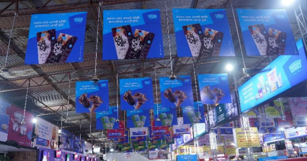 Mother Dairy and MOMS festive outdoor campaign at Lalbaugcha Raja in Mumbai featuring large-scale branding, devotional installations, and engaging touchpoints