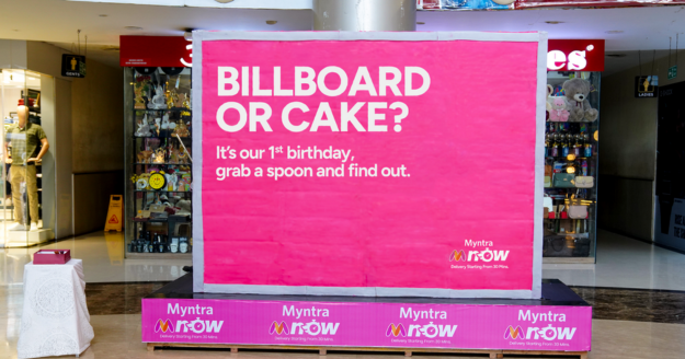 A 6-foot edible billboard created by Sociowash for Myntra M-Now’s 1st birthday, installed at Maxus Mall Borivali, designed to resemble a real billboard and surprise mall visitors when they discover it is entirely made of cake